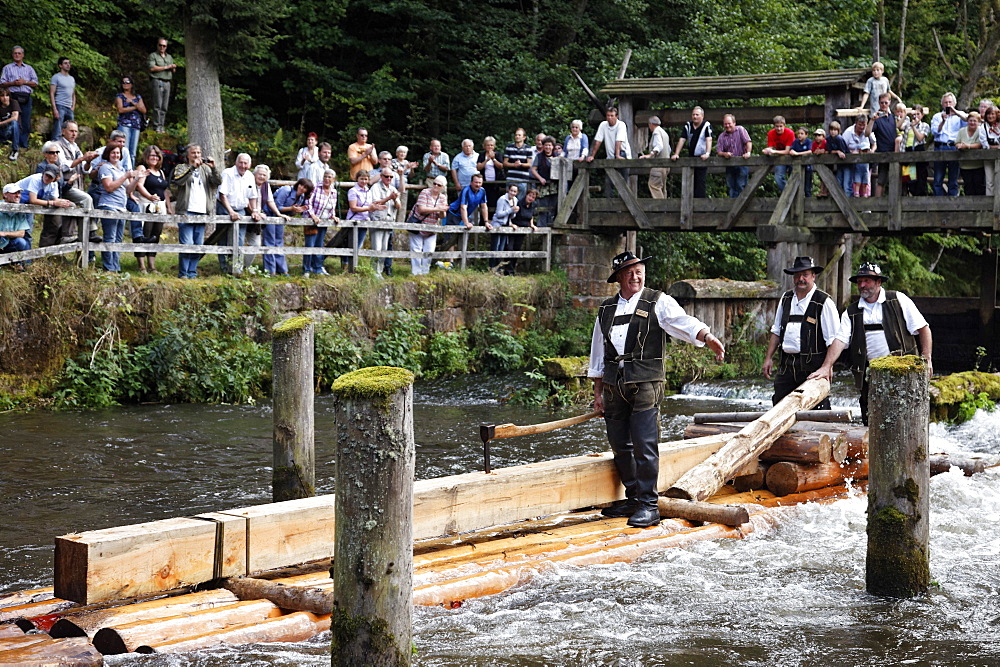 Men in traditional costumes on a raft, Timber rafting festival, Altensteig, River Nagold, Northern Black Forest, Baden Wurttemberg, Germany, Europe