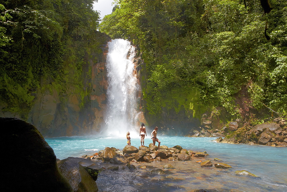 People in front of waterfall Rio Celeste, Tenorio National Park, Costa Rica, Central America, America