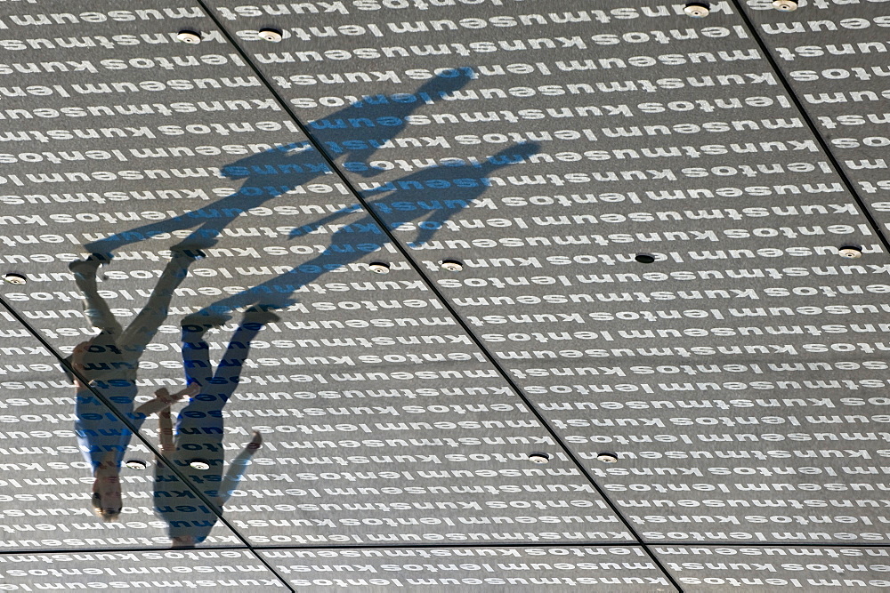 Reflection of two men at the roof of the Museum of Modern Art Lentos, Linz, Upper Austria, Austria