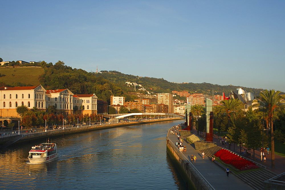 Universidad de Deusto, university at the river Rio Nervion in the evening light, Guggenheim Museum of modern and contemporary art, Bilbao, Province of Biskaia, Basque Country, Euskadi, Northern Spain, Spain, Europe