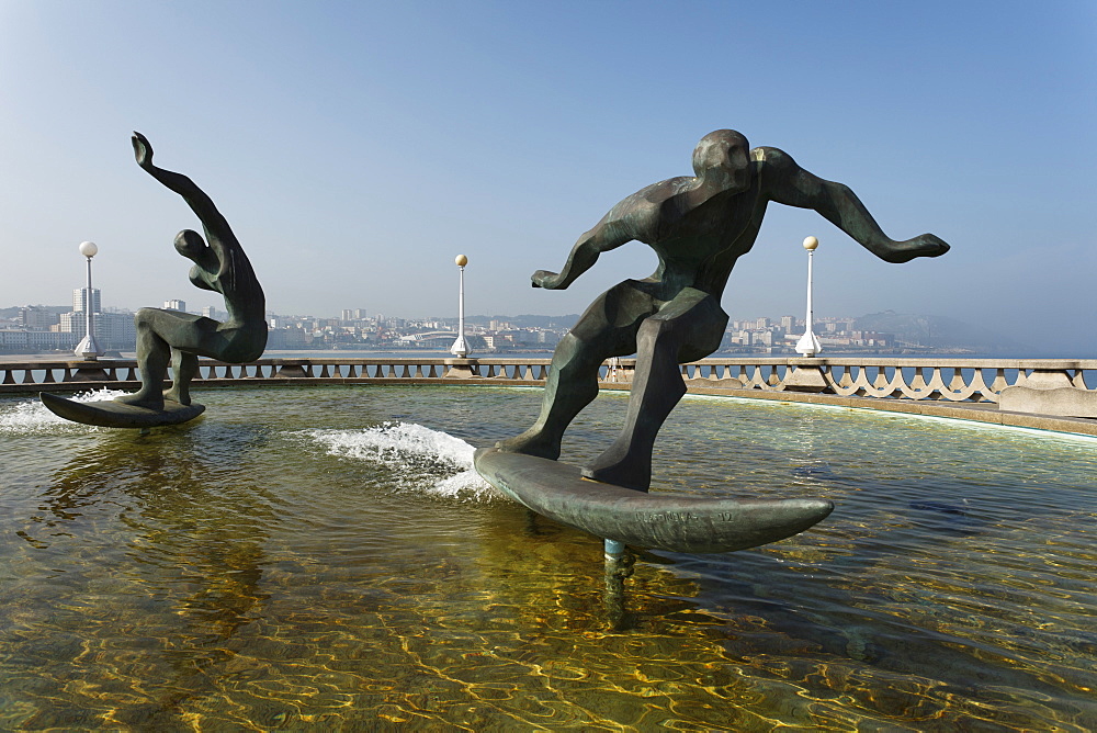 Fountain with sculpture, surfer, seaside promenade, La Coruna, A Coruna, Camino Ingles, Camino de Santiago, Way of Saint James, pilgrims way, province of La Coruna, Galicia, Northern Spain, Spain, Europe