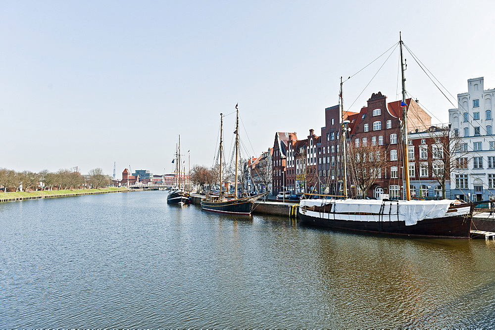 Houses with boats along the river shore, Lubeck, Schleswig Holstein, Germany