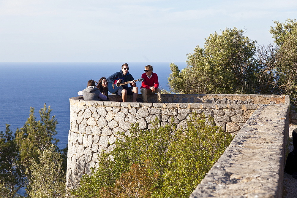 Young people with guitar, Son Marroig, former country residence of archduke Ludwig Salvator from Austria, Son Marroig near Deia, Tramantura, Mallorca, Spain