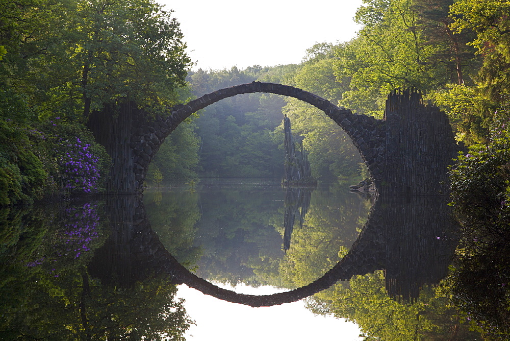 Rakotz bridge reflecting in lake Rakotzsee, Kromlau park, Kromlau, Saxony, Germany, Europe