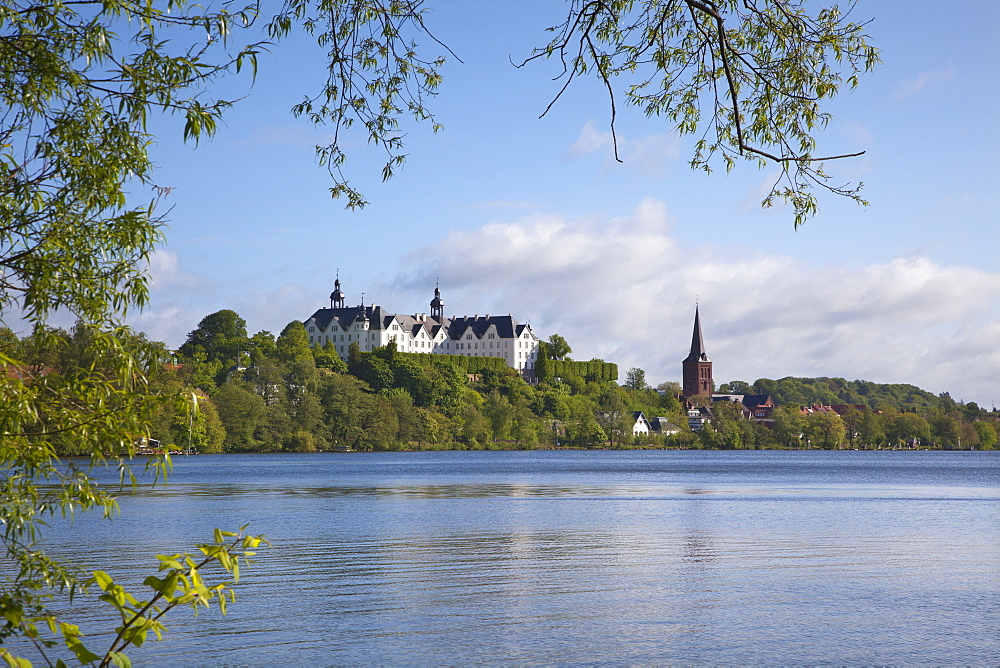 View over lake Grosser Ploener See onto the castle and the Nikolai church, Ploen, nature park Holsteinische Schweiz, Baltic Sea, Schleswig-Holstein, Germany, Europe