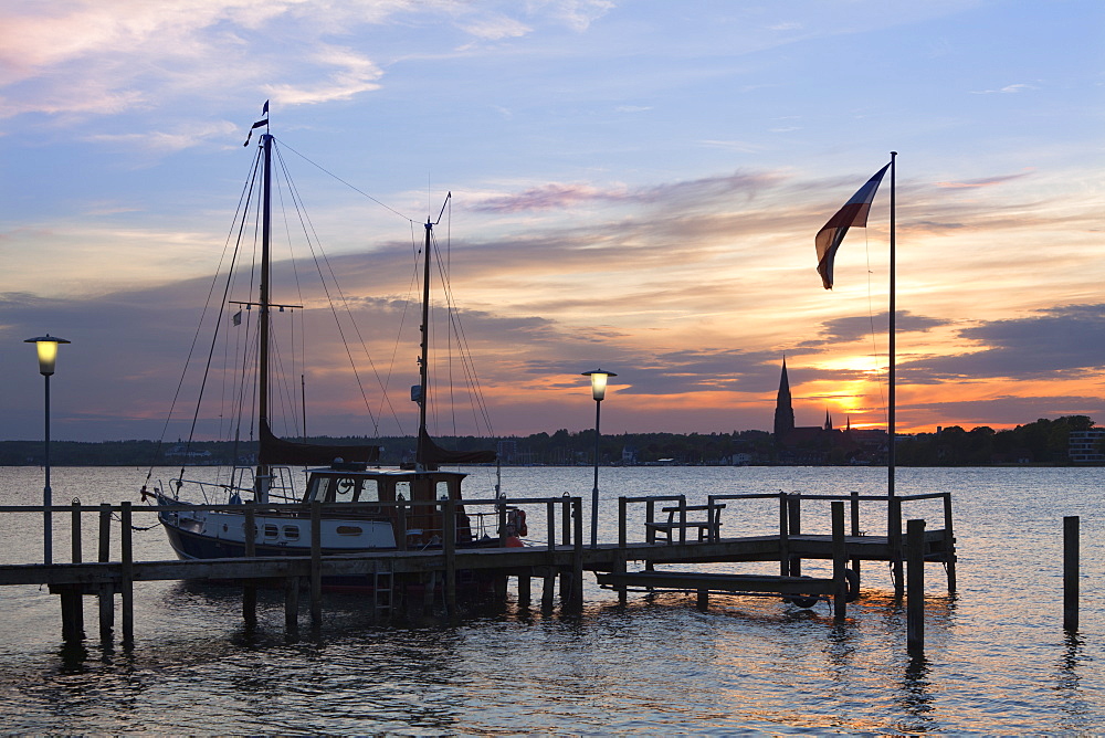 View from a pier onto the cathedral St Petri at sunset, Schleswig, Schlei fjord, Baltic Sea, Schleswig-Holstein, Germany, Europe