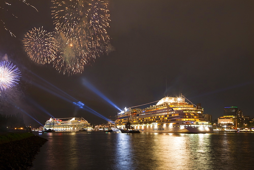 Fireworks above cruise ships AIDAblu and AIDAluna clearing port, Hamburg, Germany, Europe