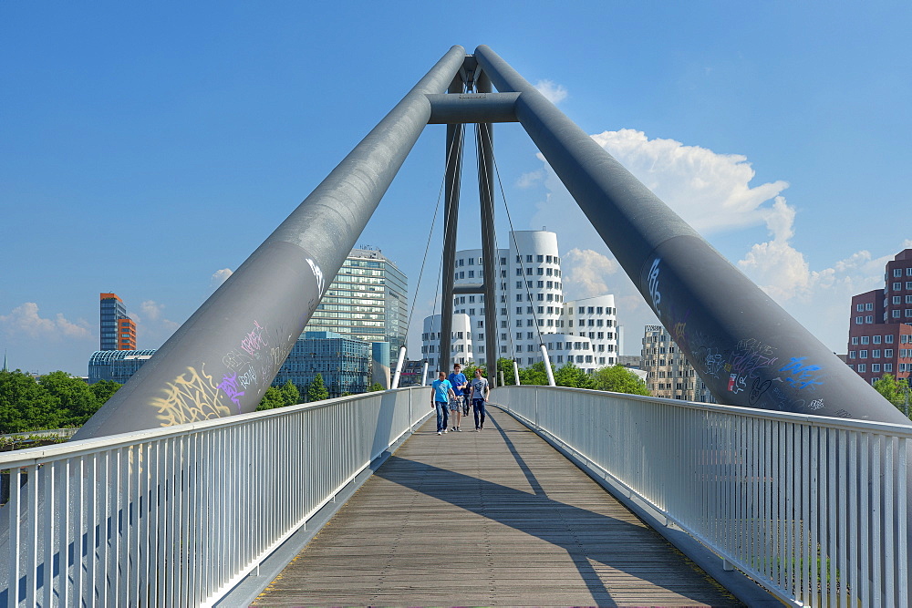 Pedestrian bridge at the Neuer Zollhof with Gehry buildings, Media harbour, Dusseldorf, Northrhine-Westphalia, Germany, Europe