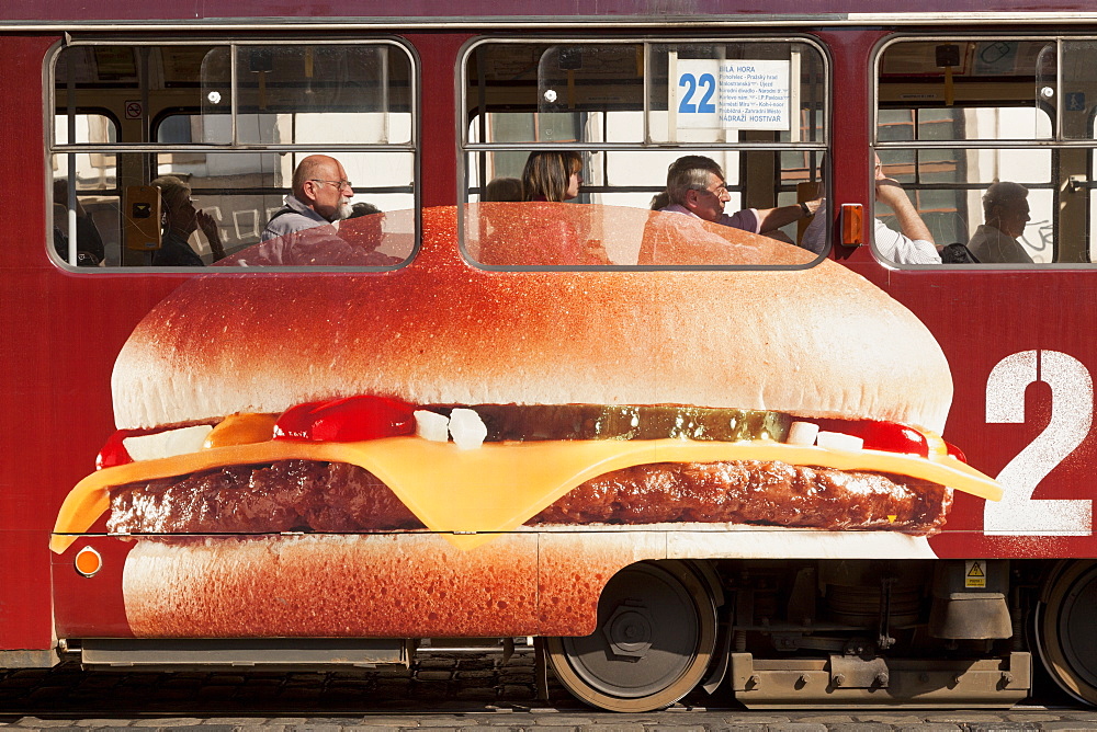 Tramcar, advertising a cheeseburger, Prag, Czech Republic