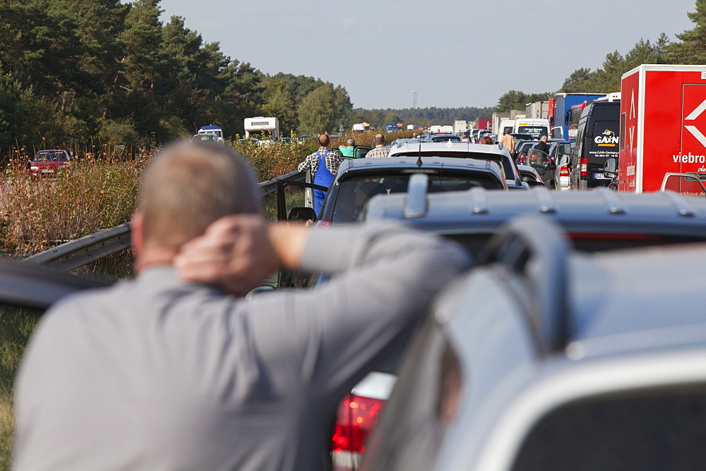 Vehicles at a standstill, people waiting in a traffic jam on a German Autobahn, Germany