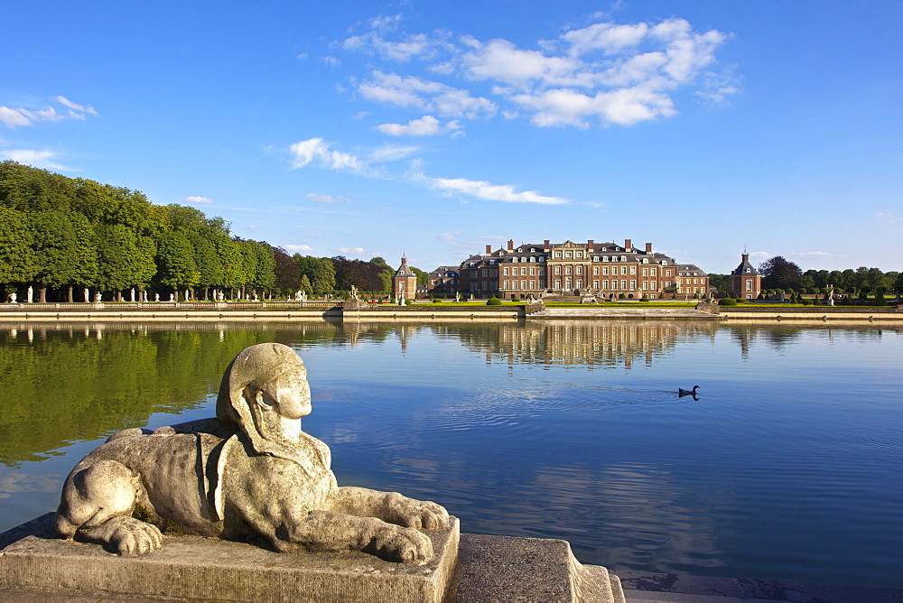 Sphinx at the stairs at the pond, Nordkirchen moated castle, Muensterland, North Rhine-Westphalia, Germany, Europe