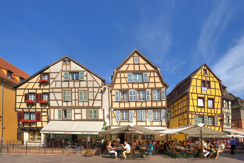 People in street cafes at the old town, Colmar, Alsace, France, Europe