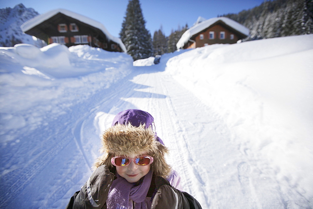 Girl (3 years) sledding, Gargellen, Montafon, Vorarlberg, Austria