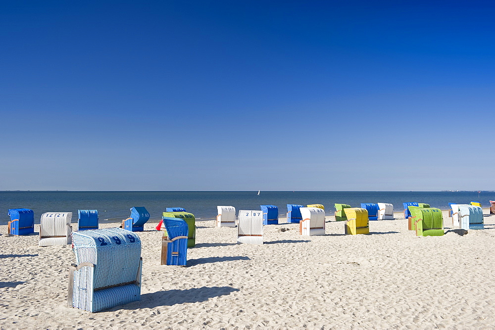 Colourful beachchairs on the beach under blue sky, Wyk, Foehr, North Frisian Islands, Schleswig-Holstein, Germany, Europe