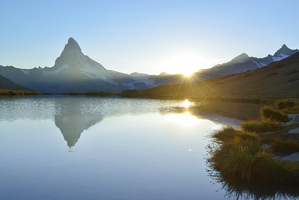 Matterhorn reflecting in mountain lake, Pennine Alps, Valais, Switzerland