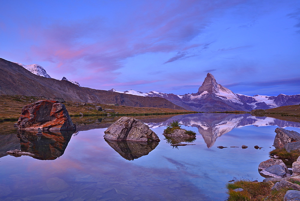 Matterhorn reflecting in a mountain lake, Pennine Alps, Valais, Switzerland