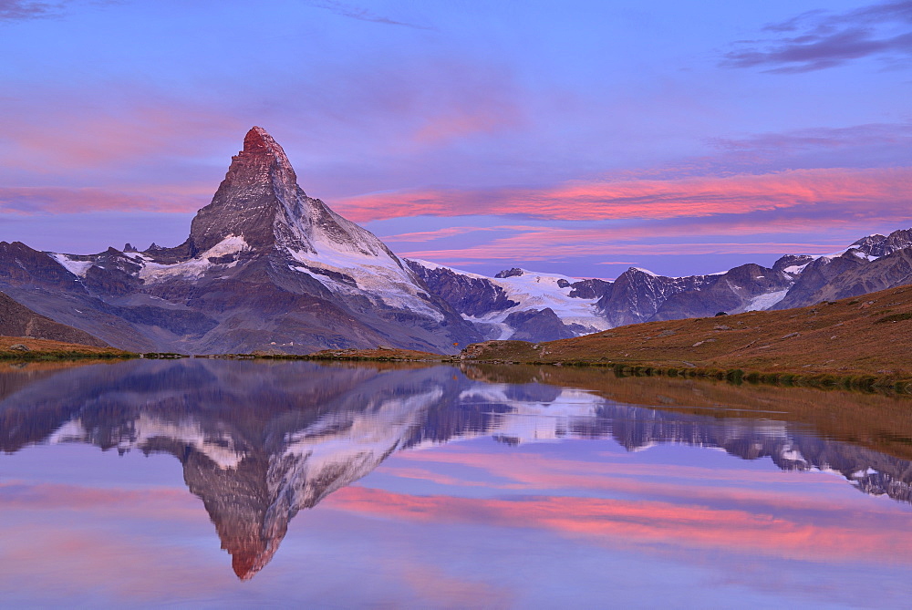 Matterhorn reflecting in a mountain lake, Pennine Alps, Valais, Switzerland