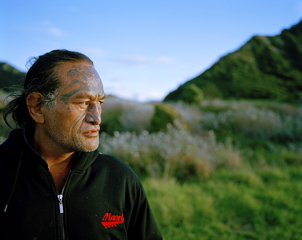 Mature Maori man with facial tatoo, Te Araroa, Eastcape, North Island, New Zealand