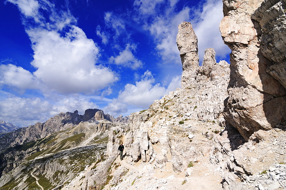 Teenager climbing on the Paternkofel fixed rope route past the Frankfurter Wuerstel rock, via ferrata, Boedenseen, Hochpustertal, Dolomites, South Tyrol, Italy