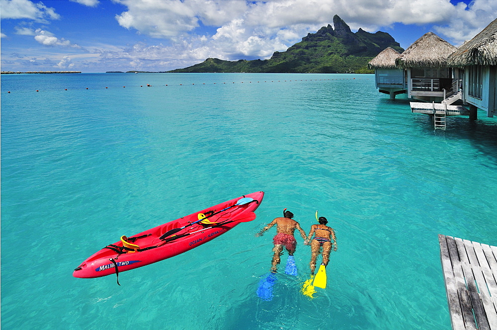 Couple snorkelling, Saint Regis Bora Bora Resort, Bora Bora, Society Islands, French Polynesia, Windward Islands, South Pacific