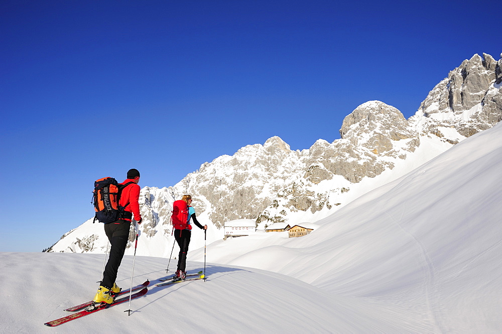 Two backcountry skiers ascending to hut Gruttenhuette, Kaiser-Express, Rote-Rinn-Scharte, Wilder Kaiser, Kaiser mountain range, Tyrol, Austria