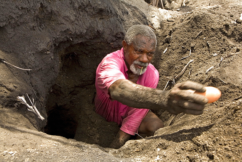 The only source of income for people on Matupit island are the eggs from the Megapode bird, a small bird, that lays massive eggs in the hot volcanic ash and trusts the volcano to incubate them. One egg costs 2 Kina, 50 Euro cent, on the market, Tavurvur Volcano, Rabaul, East New Britain, Papua New Guinea, Pacific