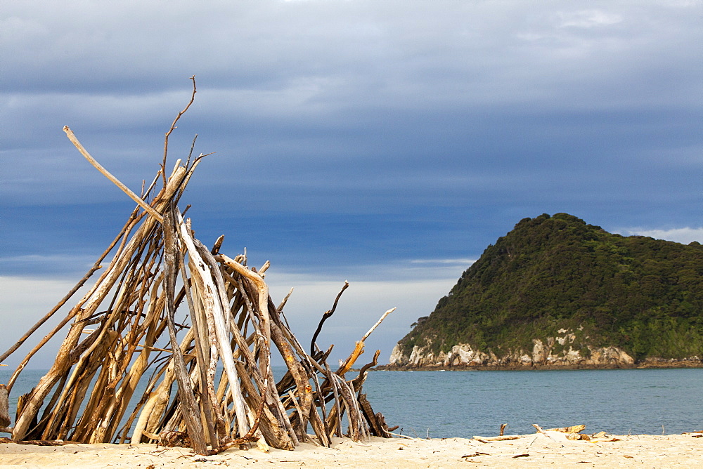 Driftwood tipi, teepee, Awaroa Inlet, Abel Tasman Coastal Track, one of New Zealand's Great Walks in the north-west of South Island, Abel Tasman National Park, South Island, New Zealand