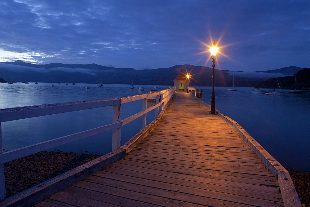 Sunset at the pavilion on Daly's Wharf, Akaroa jetty Banks Peninsula, Canterbury, South Island, New Zealand