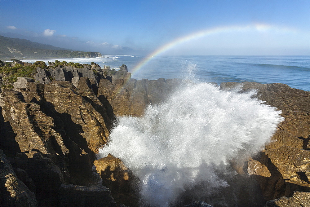 Rainbow over Pancake rocks at Punakaiki, Dolomite Point, Tasman Sea, South Island, New Zealand