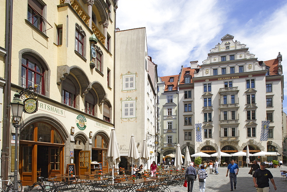 People at the square Platzl in front of the Orlandohaus, Munich, Bavaria, Germany