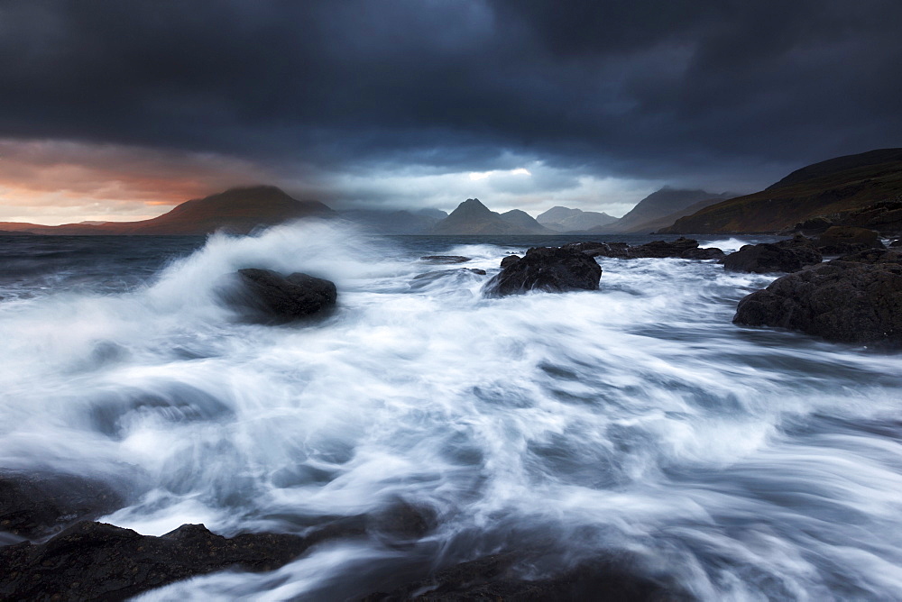 Rampaging surf at the beach of Elgol with the view to Cuillin Hills on the Isle of Skye, Scotland, United Kingdom