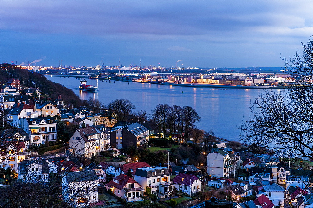 Twilight over Blankenese Treppenviertel with the river Elbe and airbus factory in the background, Hamburg, Germany