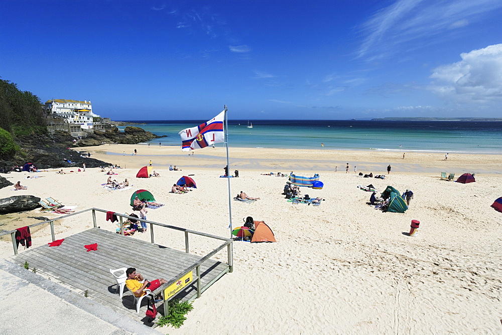 People sunbathing at Porthminster Beach, St. Ives, Cornwall, England, United Kingdom