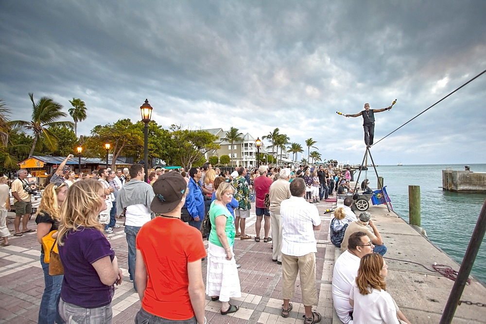 Tightrope walker at the Daily Sunset Celebrations, Mallory Square, Key West, Florida Keys, Florida, USA