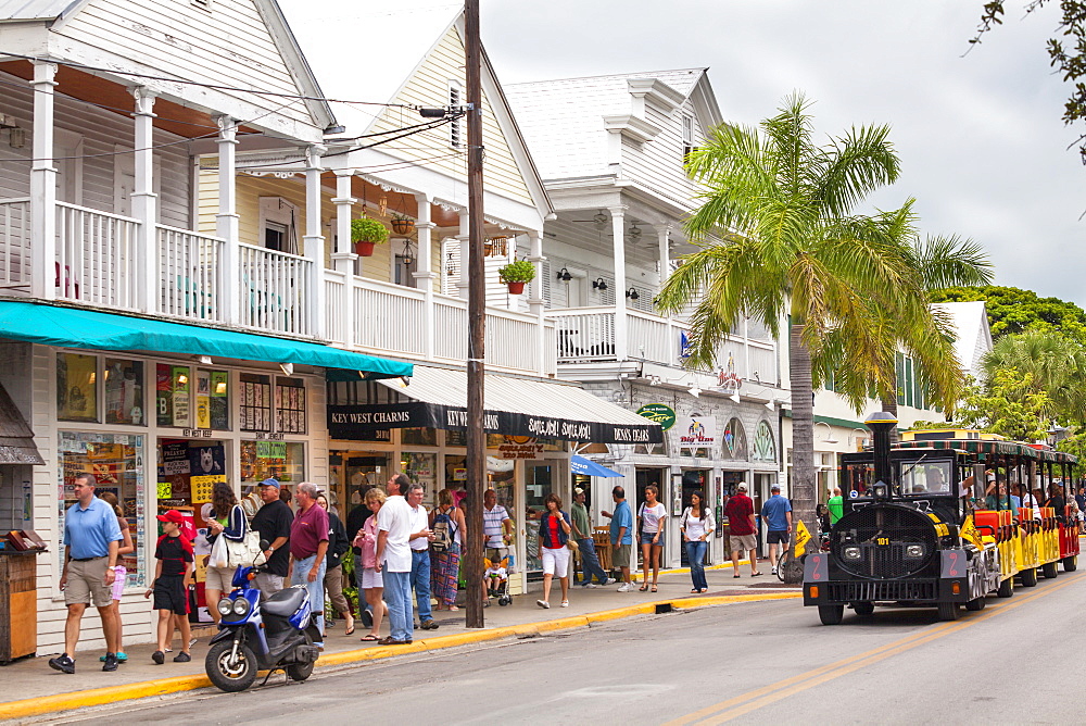 The Conch Tour Train on the main shopping street, Duval Street, Key West, Florida Keys, USA