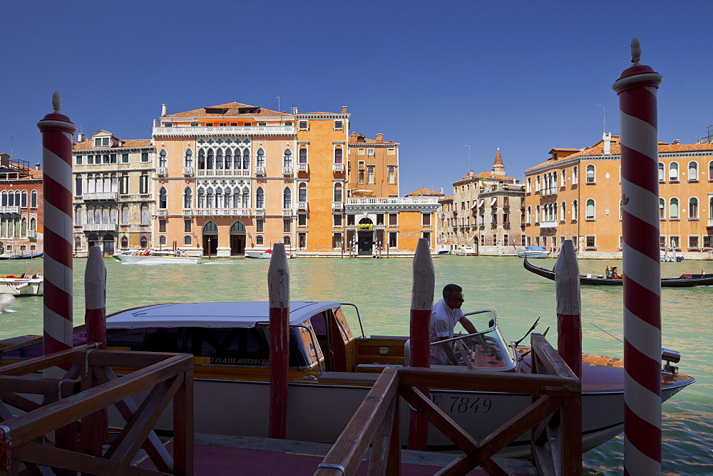 Jetty with boat on the Grand Channel, Palazzo Barbarigo della Terrazza, Venice, Italy