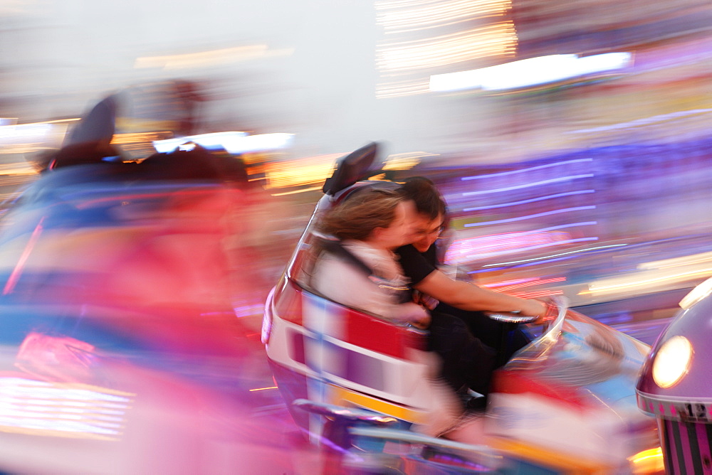 People at Carnival ride in the evening, Oktoberfest, Munich, Bavaria, Germany