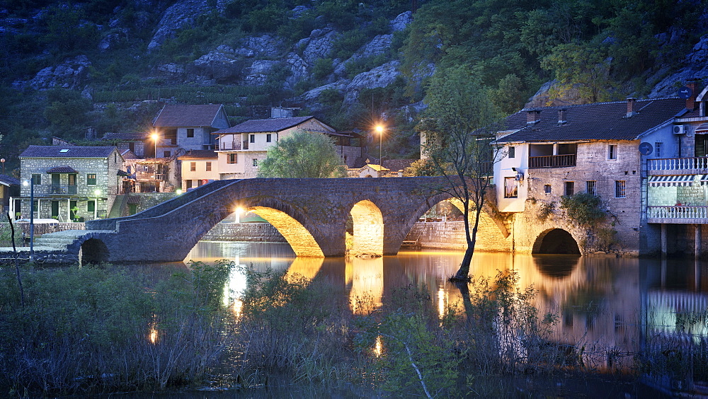 Stone bridge, Stari Most at dusk, Rijeka Crnojevica, Lake Skadar National Park, Montenegro, Western Balkan, Europe