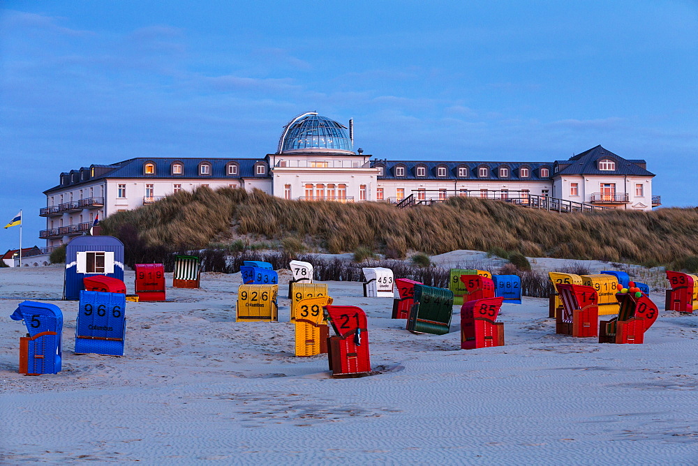 Spa Hotel at dusk, beach chairs, Juist Island, Nationalpark, North Sea, East Frisian Islands, East Frisia, Lower Saxony, Germany, Europe