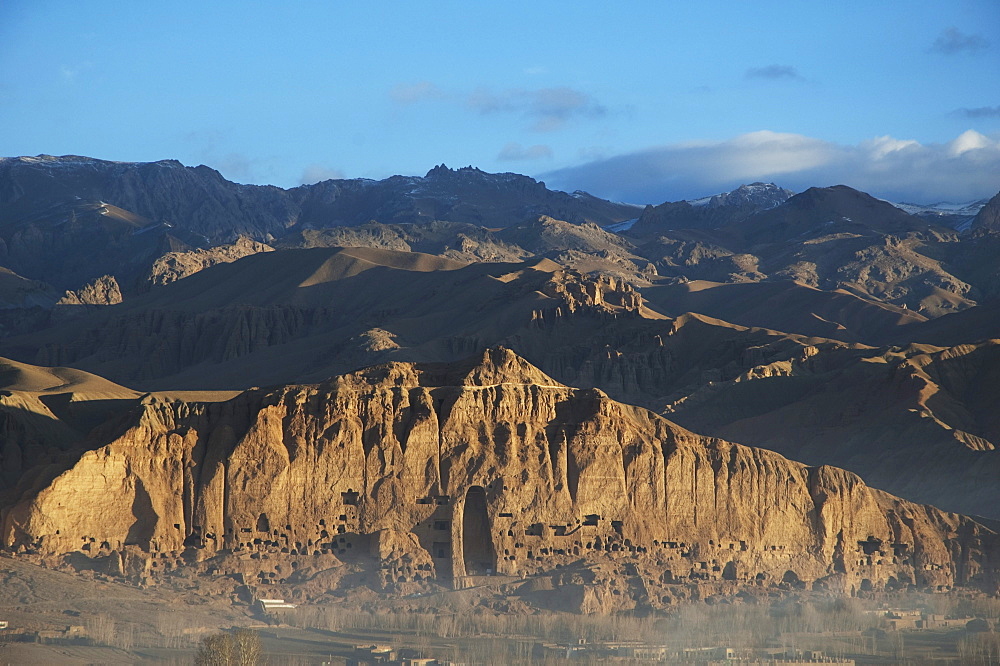 Panoramic view of Bamiyan and the escarpment with hundreds of caves and the niche that contained the Small Buddha statue destroyed by the Taliban in 2001, Bamian Province, Afghanistan