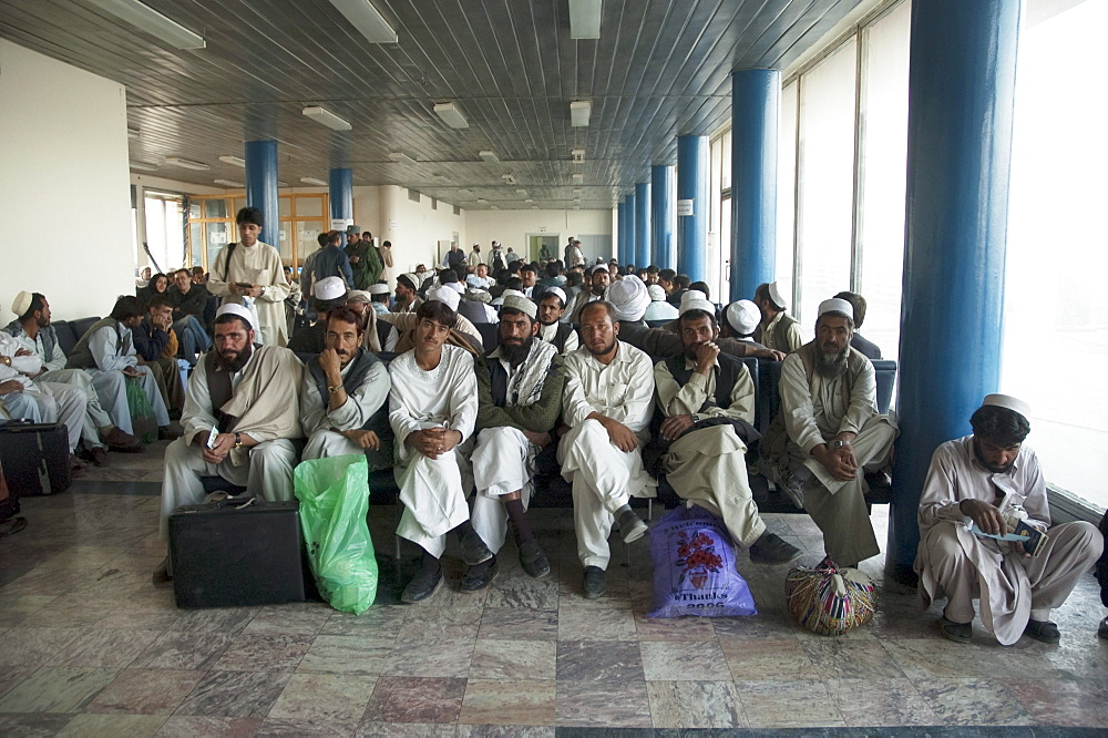 Passengers waiting at the main terminal building of the Kabul International Airport for the departure of their flight, , Afghanistan