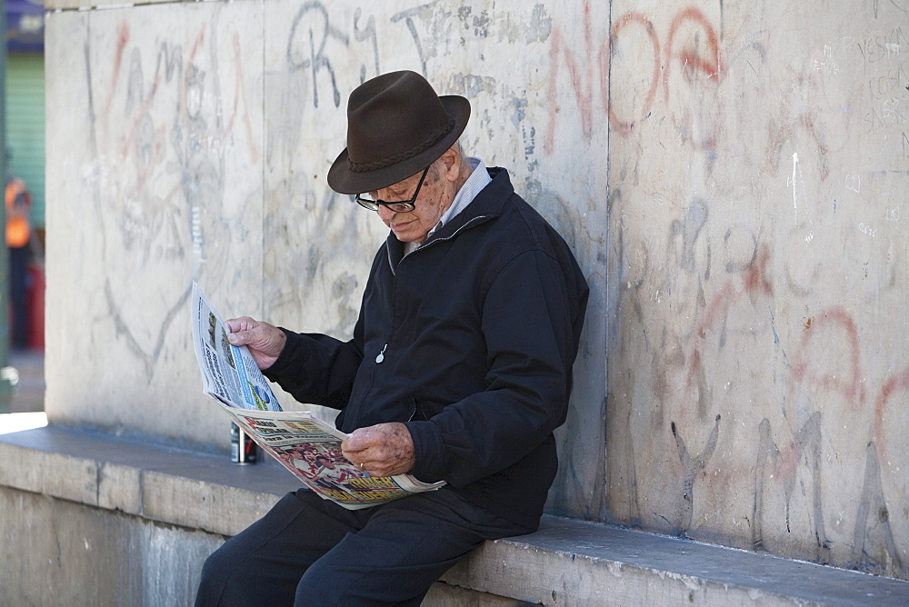 Old man with newspaper in Barrio La Boca, Buenos Aires, Capital Federal, Argentina