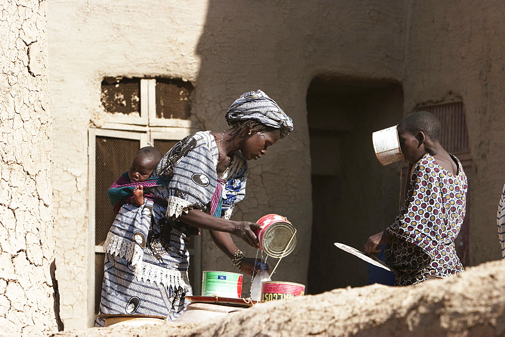 People washing by the Great Mosque, Djenne, Mali