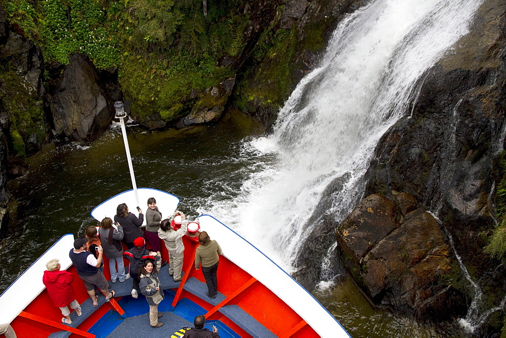 MV Skorpios next to a waterfall in Quitralco Fjord, AisâˆšÂ©n Region, Chile