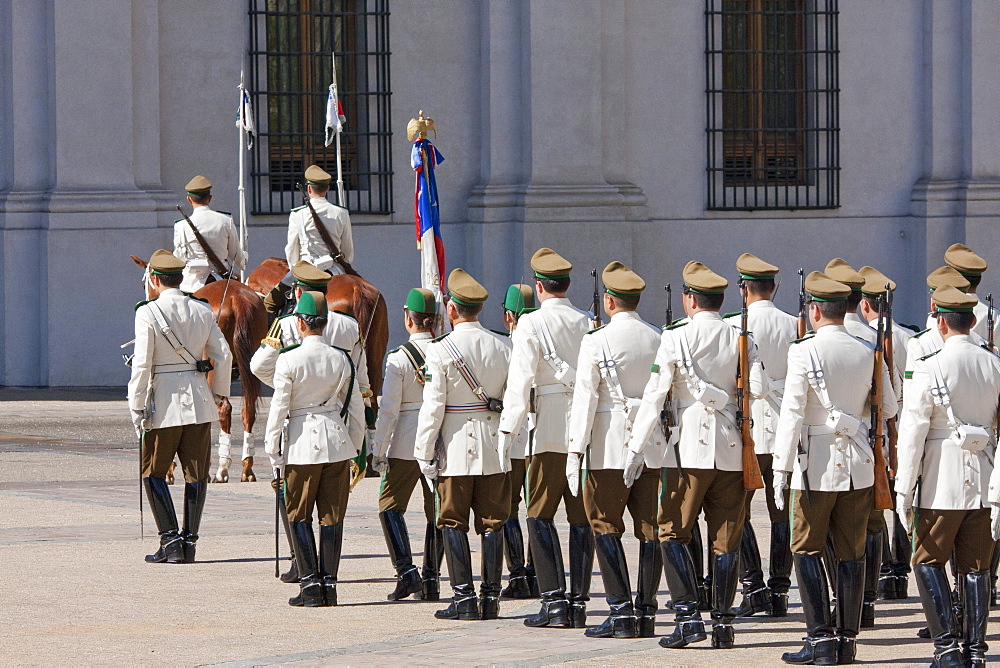 Changing of the guards by Carabineros on Plaza de la Constitucion in front of the Palacio de la Moneda Presidential Palace, Santiago, Regiâˆšâ‰¥n Metropolitana, Chile