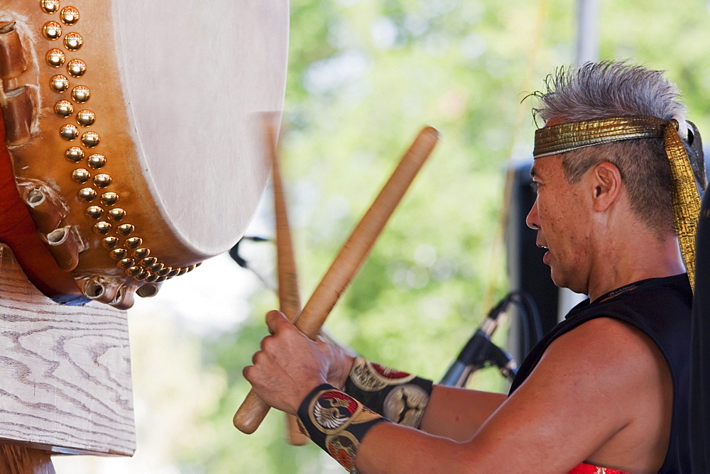 Kenny Endo performing on the Taiko, a traditional Japanese drum at the Powell Street Festival in Woodland Park, Vancouver, British Columbia, Canada