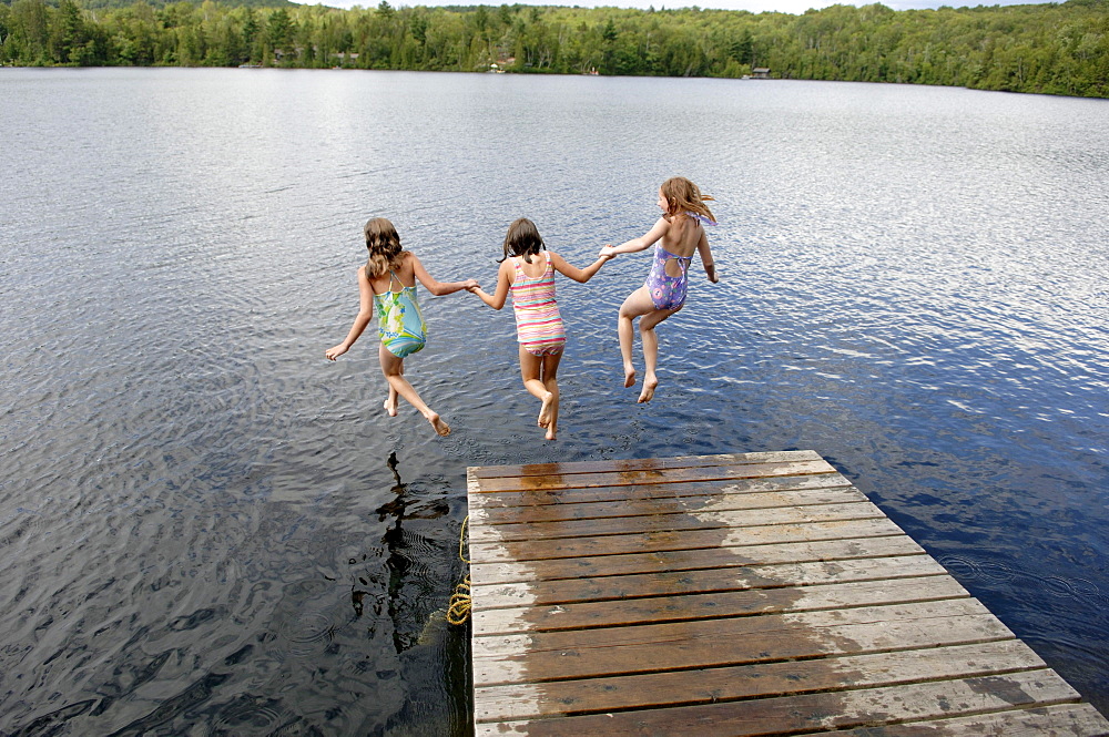 Young Girls Jumping into Lac des Neiges, Quebec