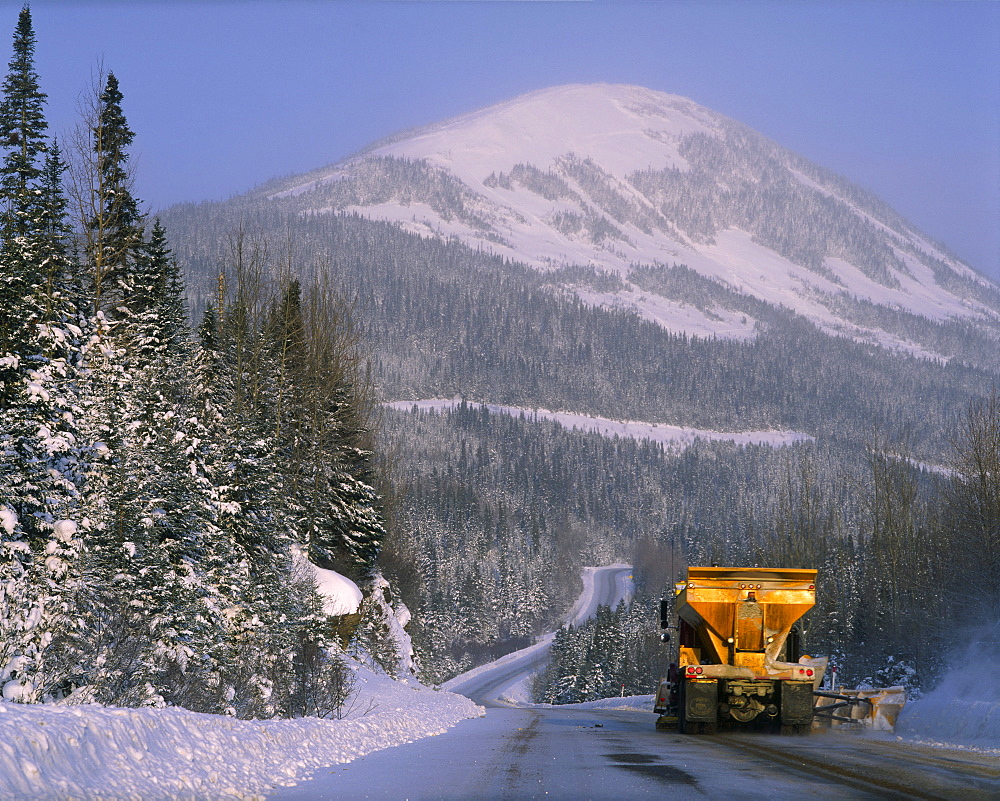 Snowplow on Road and Mount Hog, Chic-Choc mountains Gaspesie region, Quebec