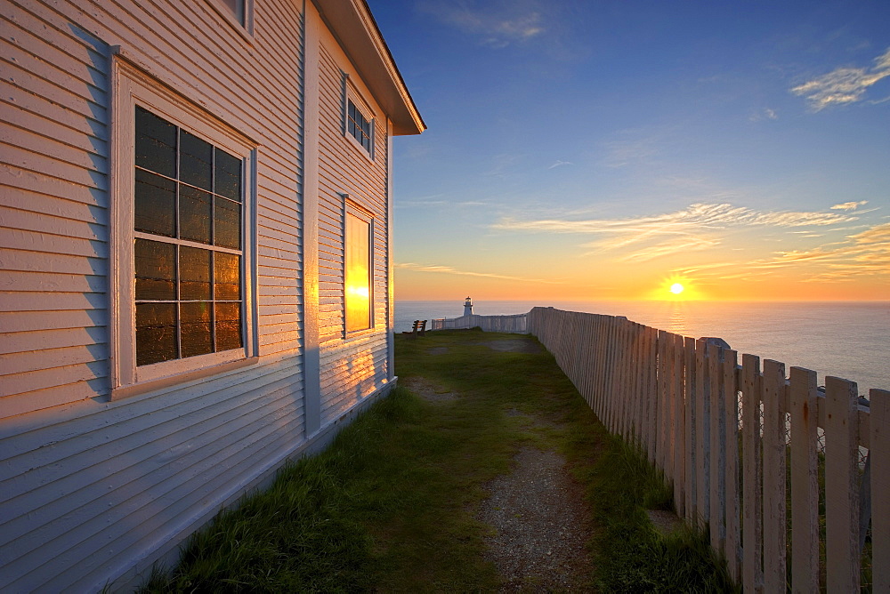 Cape Spear Lighthouse in the distance at Sunrise, Cape Spear National Historic Site, Avalon Peninsula, Newfoundland