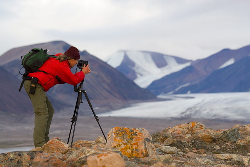 Photographer by glacier in Tay Bay, Sirmilik National Park, Nunavut, Canada